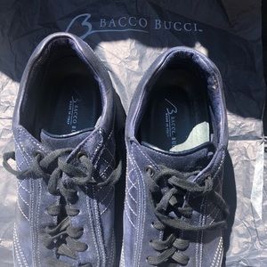 Men’s causal shoe; navy blue with white stitching.